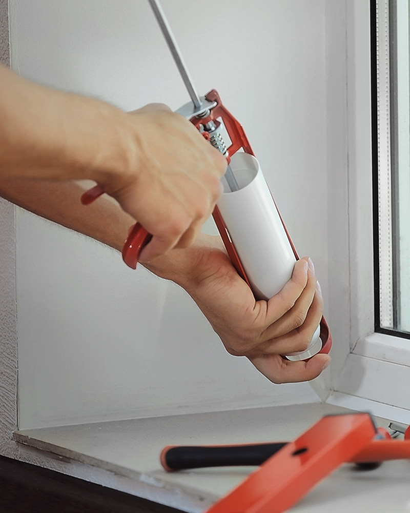 caulking a window sill